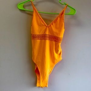 Orange swimsuit or you can use it as a T-shirt size extra small from divided